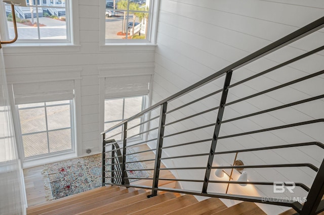 stairway with wood finished floors