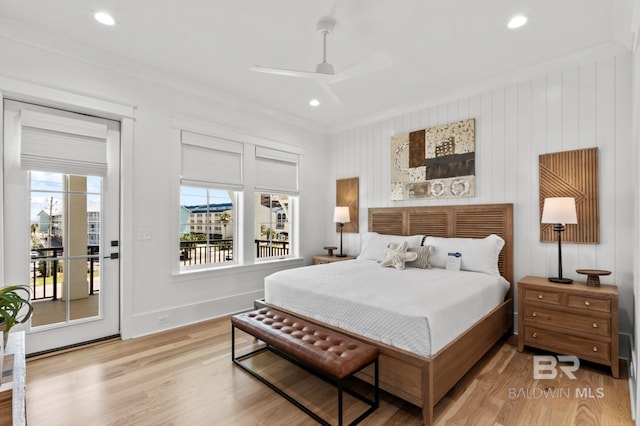 bedroom with ornamental molding, access to outside, baseboards, and wood finished floors