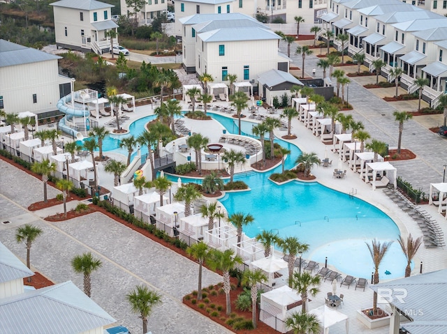 view of swimming pool featuring a residential view