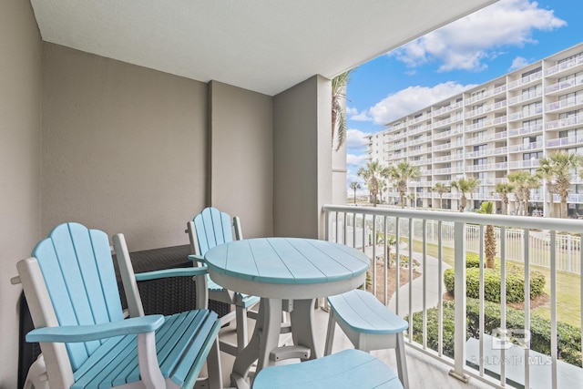 balcony featuring outdoor dining area