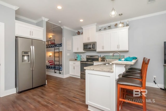 kitchen featuring sink, crown molding, stainless steel appliances, and white cabinets