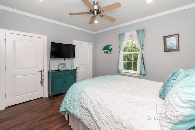 bedroom featuring ceiling fan, ornamental molding, and dark hardwood / wood-style floors