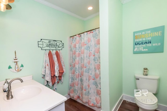 bathroom featuring toilet, wood-type flooring, ornamental molding, vanity, and curtained shower