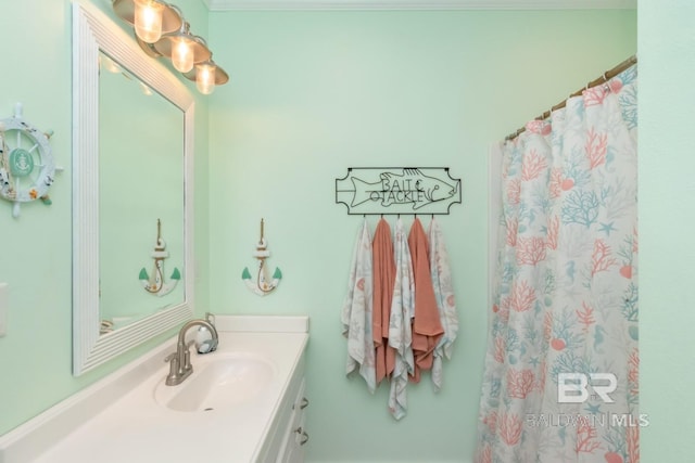 bathroom featuring vanity and curtained shower