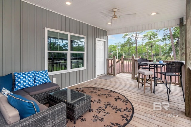 sunroom featuring ceiling fan and a healthy amount of sunlight