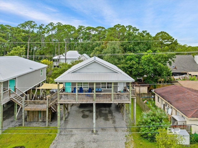 exterior space featuring a carport and covered porch