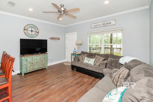 living room featuring crown molding, ceiling fan, and wood-type flooring