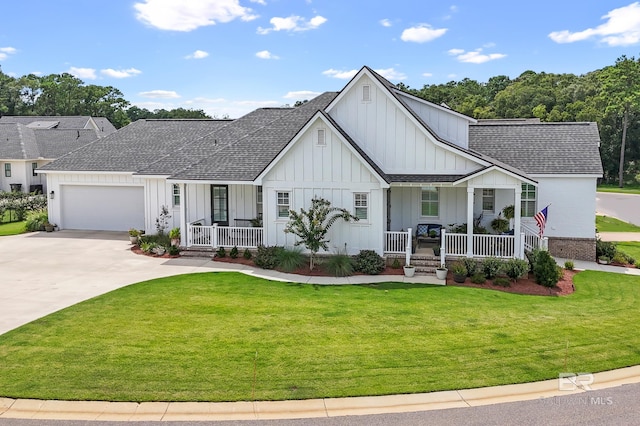 887 Geranium Dr, Fairhope, AL 36532 - modern inspired farmhouse featuring a porch, board and batten siding, a shingled roof, and a front lawn