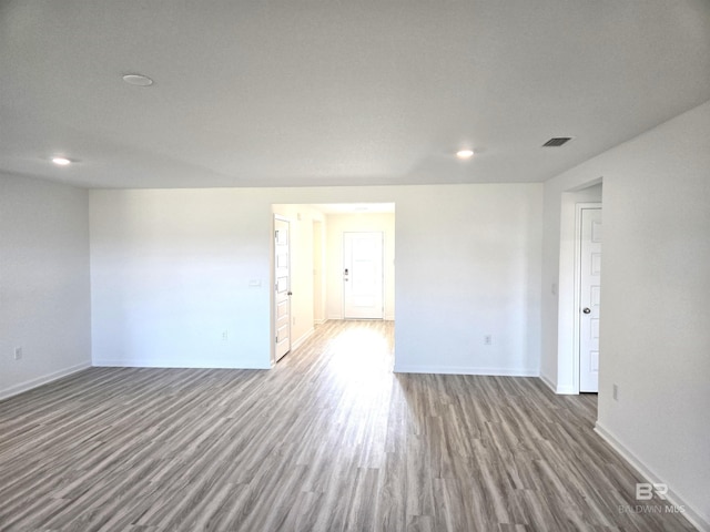 spare room with hardwood / wood-style floors