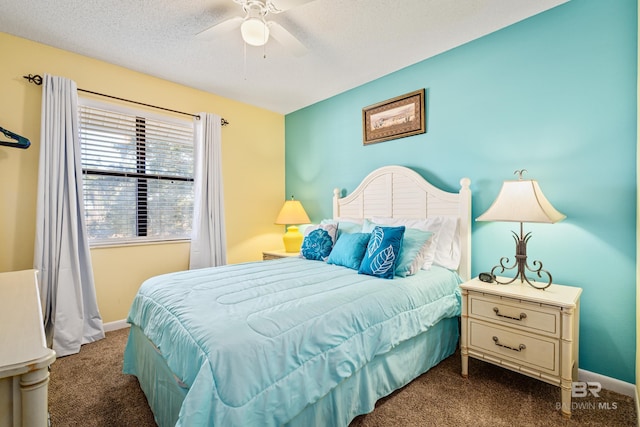 carpeted bedroom featuring a textured ceiling, ceiling fan, and baseboards