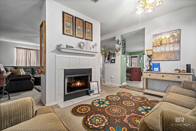 2511 Herman B Towner St, Eight Mile, AL 36613 - carpeted living room featuring a textured ceiling, a fireplace, and baseboards