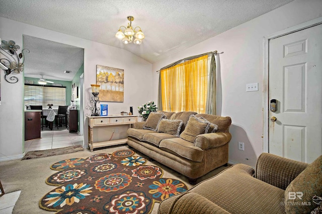 2511 Herman B Towner St, Eight Mile, AL 36613 - living room featuring vaulted ceiling, a textured ceiling, a chandelier, light colored carpet, and baseboards