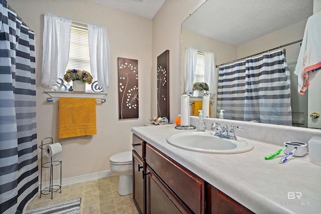 2511 Herman B Towner St, Eight Mile, AL 36613 - bathroom featuring toilet, vanity, baseboards, a textured ceiling, and a shower with shower curtain