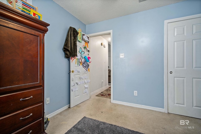 2511 Herman B Towner St, Eight Mile, AL 36613 - bedroom featuring baseboards, a textured ceiling, and carpet flooring