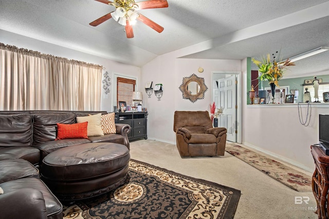 2511 Herman B Towner St, Eight Mile, AL 36613 - carpeted living room featuring ceiling fan, a textured ceiling, baseboards, and lofted ceiling
