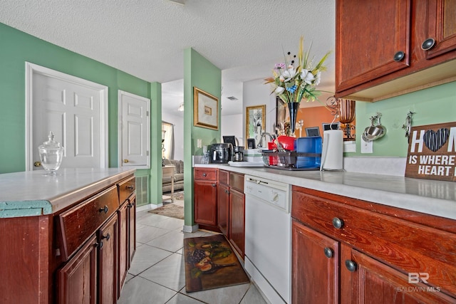 2511 Herman B Towner St, Eight Mile, AL 36613 - kitchen with dishwasher, light tile patterned flooring, light countertops, and a textured ceiling