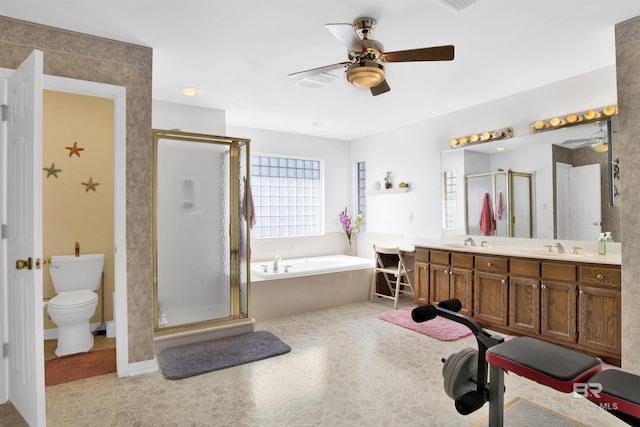 bathroom featuring a bath, a shower stall, and a sink