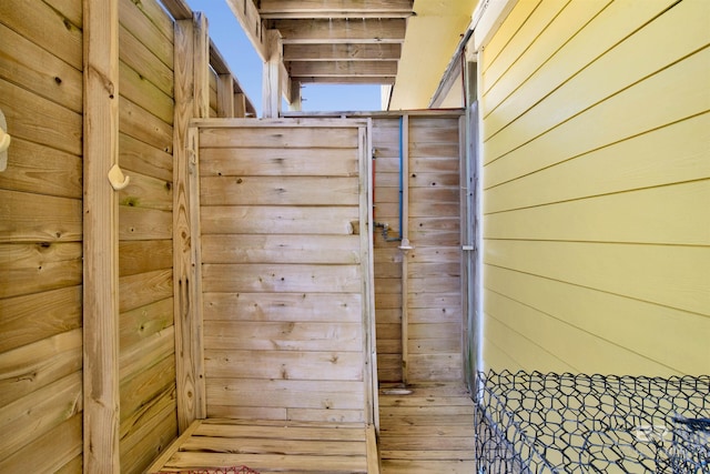 room details with a barn door and wooden walls