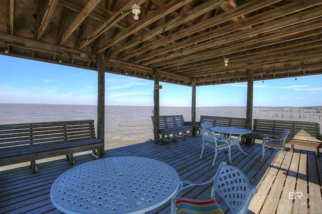 deck with a water view and a view of the beach