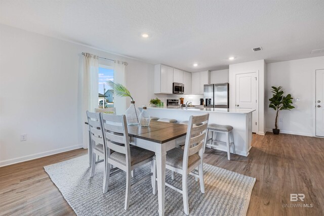 16770 Prado Loop, Loxley, AL 36551 - dining space featuring wood finished floors and recessed lighting