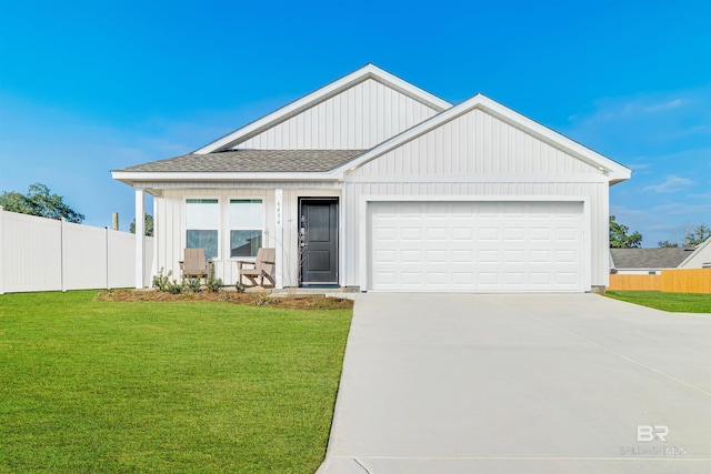16770 Prado Loop, Loxley, AL 36551 - view of front of home featuring a garage, concrete driveway, and roof with shingles