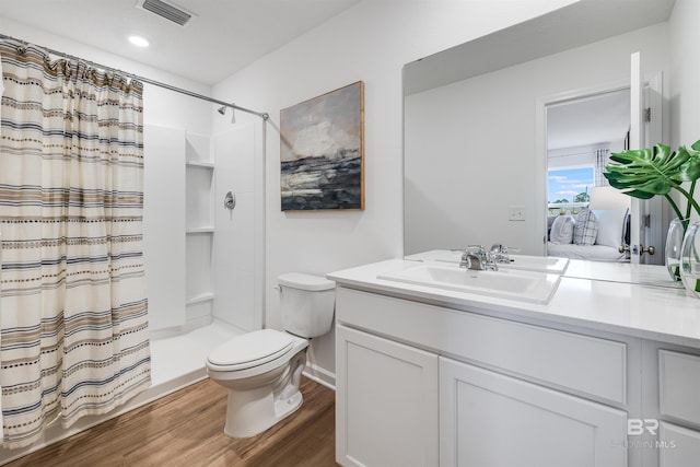 16770 Prado Loop, Loxley, AL 36551 - full bath featuring wood finished floors, vanity, and a shower with shower curtain