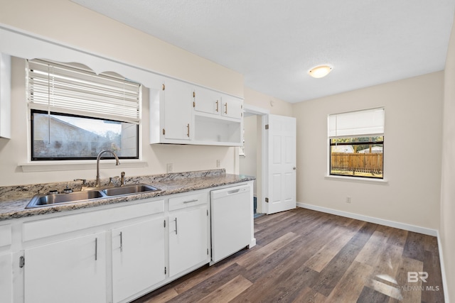 kitchen featuring white dishwasher, white cabinetry, dark hardwood / wood-style floors, and sink