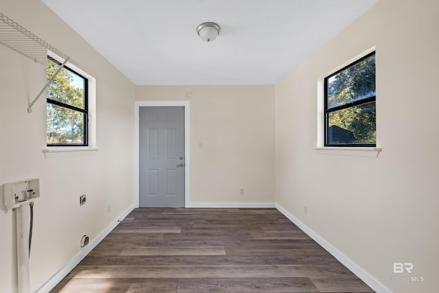 washroom with washer hookup, dark wood-type flooring, and electric dryer hookup