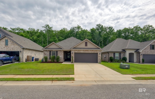 view of front of house with an attached garage, brick siding, a front yard, and concrete driveway