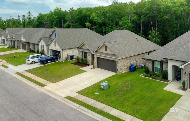 view of front of home with a front yard, stone siding, a shingled roof, concrete driveway, and an attached garage
