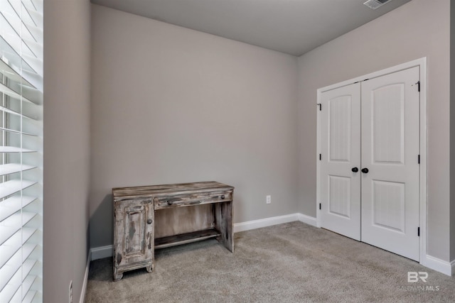 bedroom featuring a closet, baseboards, carpet flooring, and visible vents