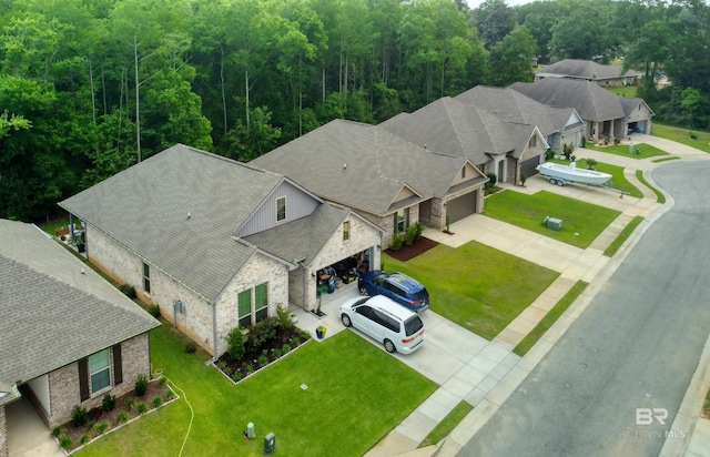 birds eye view of property with a wooded view