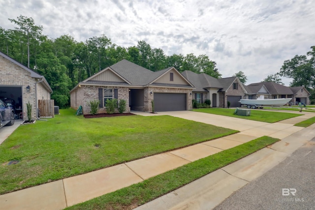 view of front of home featuring an attached garage, driveway, a front lawn, and brick siding