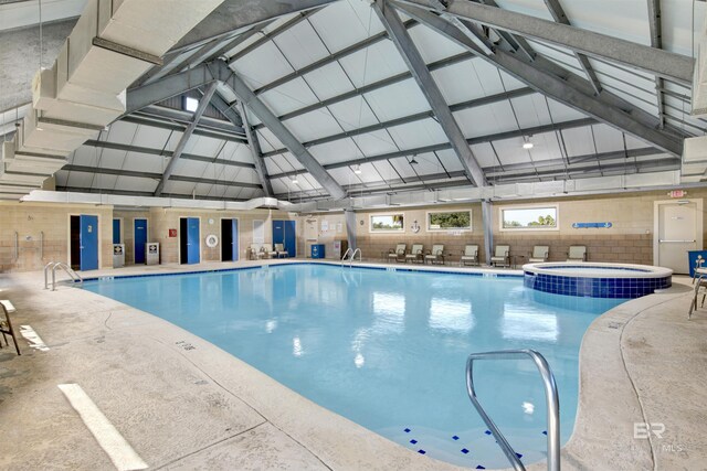 view of pool with a pool with connected hot tub and a patio