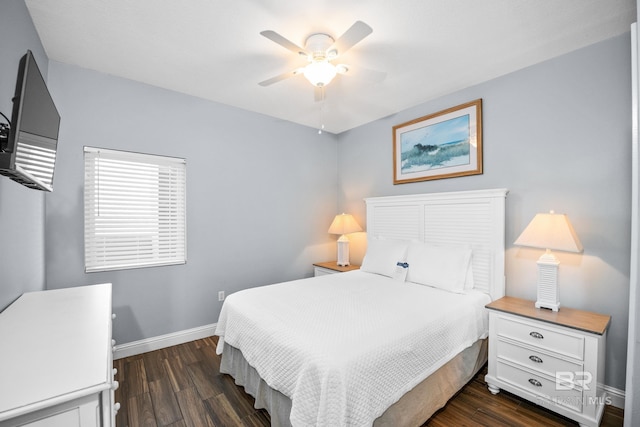 bedroom featuring a ceiling fan, baseboards, and dark wood-style flooring