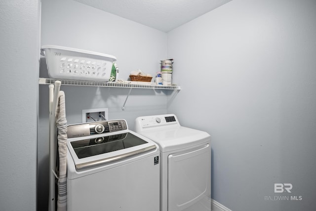 clothes washing area with laundry area and independent washer and dryer