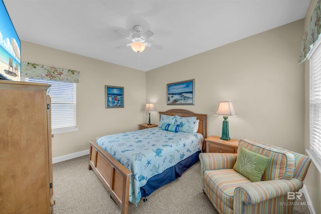 bedroom featuring ceiling fan, baseboards, and carpet floors