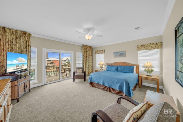 carpeted bedroom featuring visible vents, multiple windows, access to exterior, and crown molding