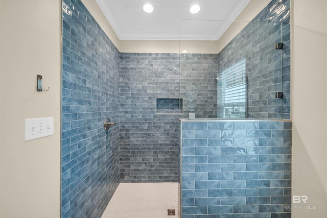 full bath with recessed lighting, ornamental molding, and a tile shower