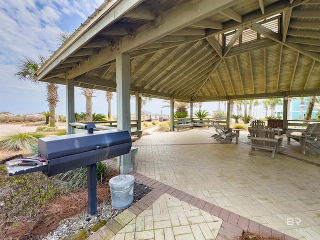 view of patio with a gazebo and outdoor dining area