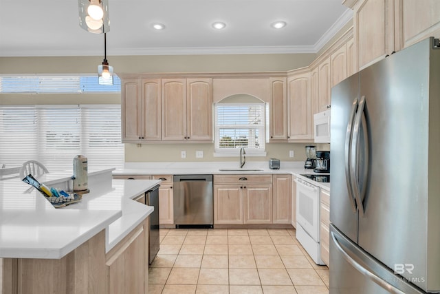 kitchen featuring light brown cabinets, light countertops, light tile patterned floors, appliances with stainless steel finishes, and a sink