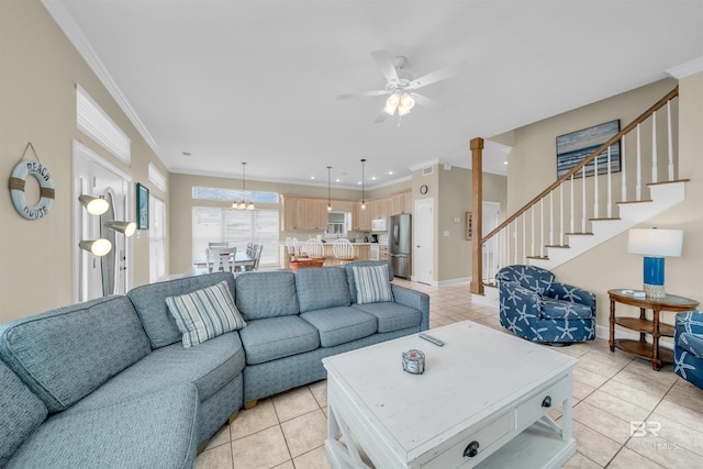 living room featuring light tile patterned floors, stairway, crown molding, and baseboards