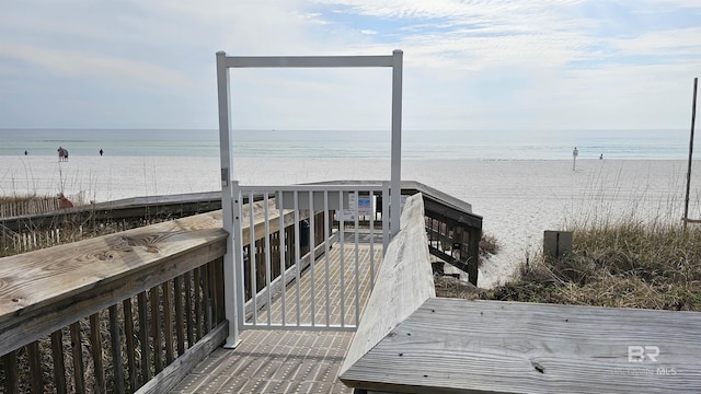 view of home's community featuring a view of the beach and a water view