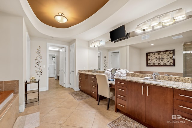 bathroom featuring tile patterned floors, a tray ceiling, vanity, and independent shower and bath