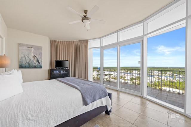 bedroom featuring access to outside, ceiling fan, and light tile patterned floors