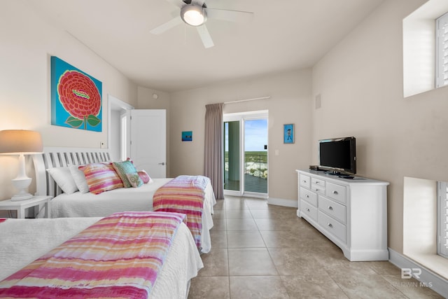 bedroom featuring ceiling fan, light tile patterned flooring, and access to exterior