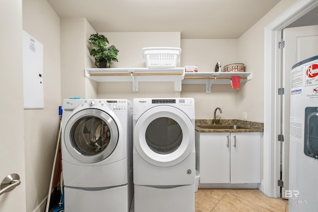 laundry room with light tile patterned flooring, sink, and washing machine and clothes dryer