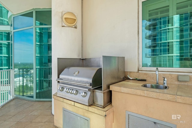 view of patio / terrace featuring area for grilling and sink