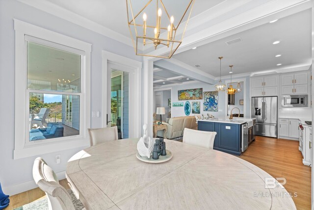 4029 Landfall Dr, Pensacola, FL 32507 - dining area with light wood-style flooring, recessed lighting, a notable chandelier, and visible vents