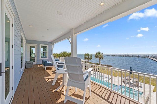4029 Landfall Dr, Pensacola, FL 32507 - wooden deck featuring a fenced in pool and a water view